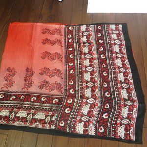 orangeish-red and black sari